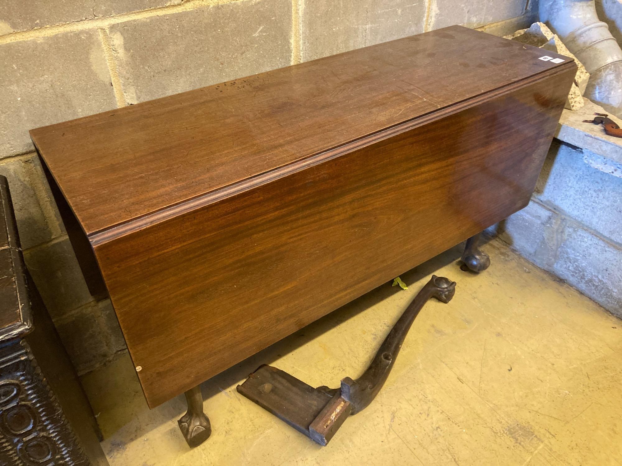 A George III mahogany drop-leaf dining table, with cabriole legs and claw and ball feet, length 122cm